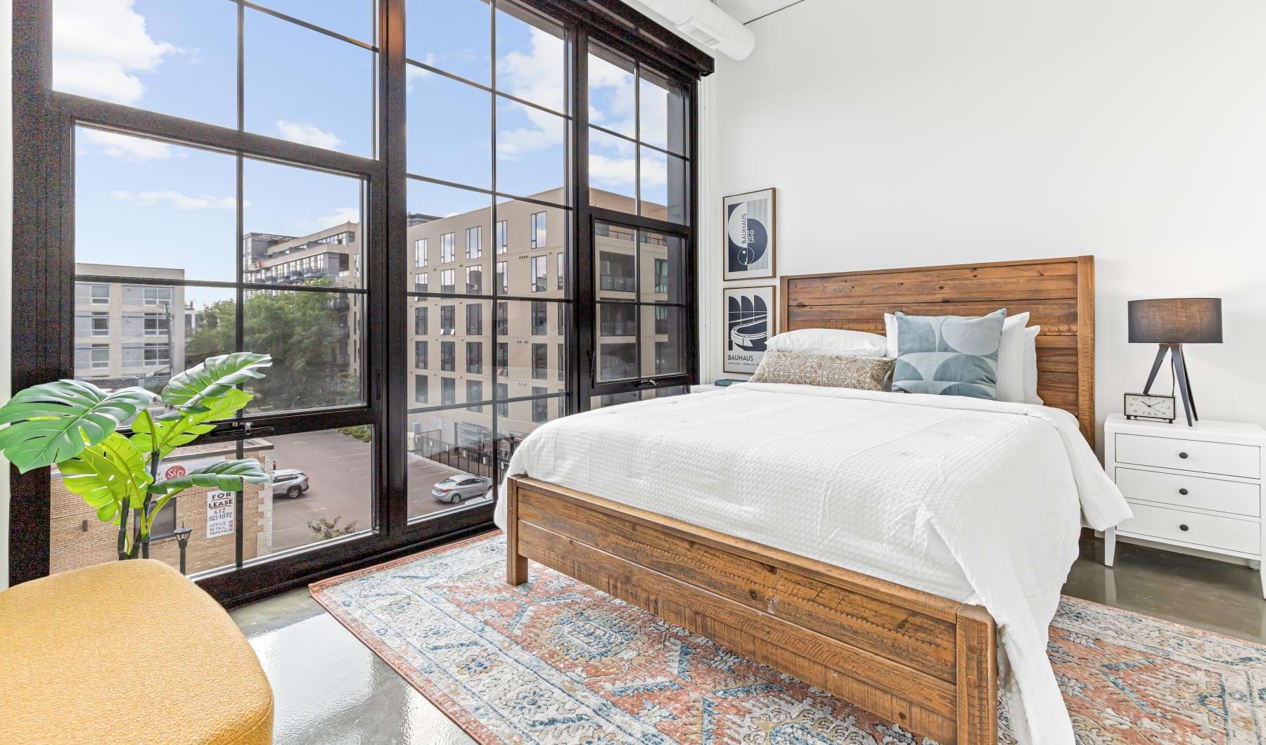 a bedroom with a large window